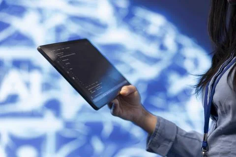 Close up of IT expert using tablet, building AI algorithms Stock Photos