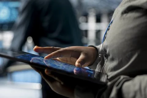 Close up of IT professional in server farm using neural networks tech on tablet Stock Photos