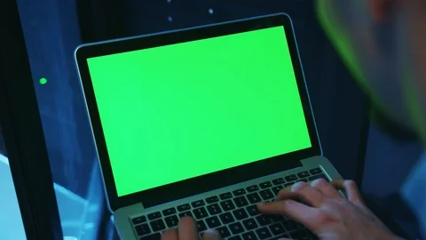 Close-up of IT server expert running a neural network on mock-up laptop green 스톡 동영상 121173212
