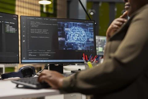 Close up of IT specialist in tech startup using artificial intelligence on PC 写真素材