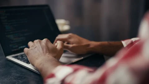 Close-up of IT specialist testing software, typing code on laptop, programming Stock Footage 313281716