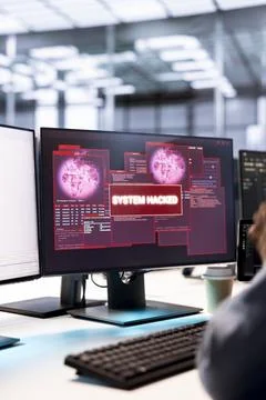 Close up of IT worker in data center fixing security breach alert Stock Photos