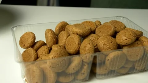 Close up Italian amaretti biscuits in clear plastic container. 스톡 동영상 171881900