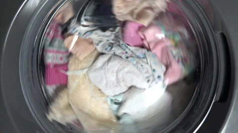 Close-up items are washed in the drum of the washing machine Stock Footage 146337166