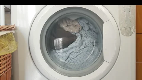 Close-up items are washed in the drum of the washing machine Vídeo Stock 150358569