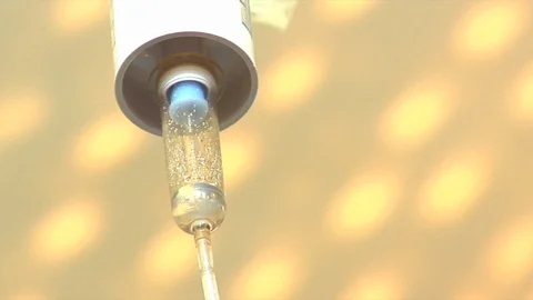 Close of IV with lights in background Stock Footage 99425601