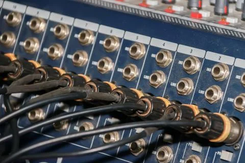 Close up of jack cable connected at rear of switcher sound mixer control panel Stock Photos