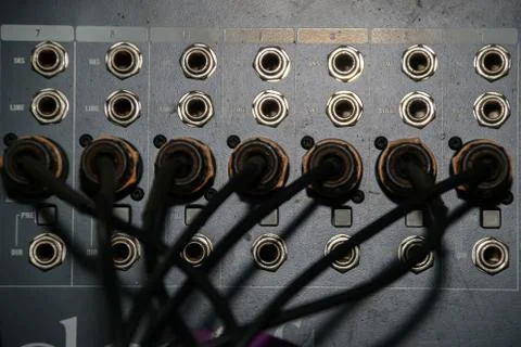 Close up of jack cable connected at rear of switcher sound mixer control panel Stock Photos