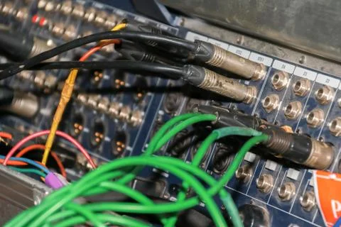 Close up of jack cable connected at rear of switcher sound mixer control panel Stock Photos