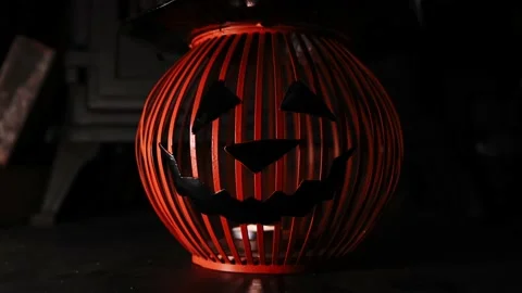 Close up of jack o lantern on fibreplace, flickinger soft warm light Video stock 140882424