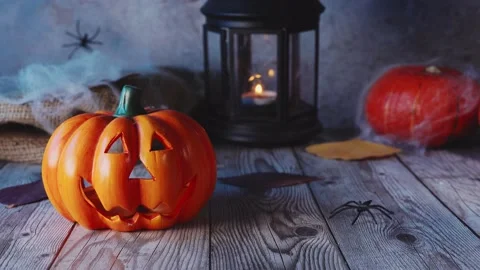 Close up of Jack-o-lanterns on scary dark blue windy background Stock Footage 138383939