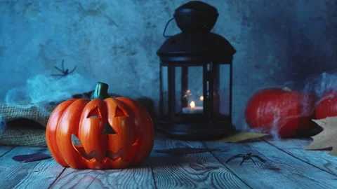 Close up of Jack-o-lanterns on scary dark blue windy background Stock Footage 138383961