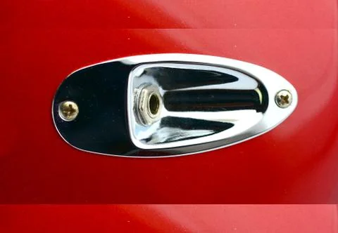 Close up of the jack output socket of a electric guitar Stock Photos