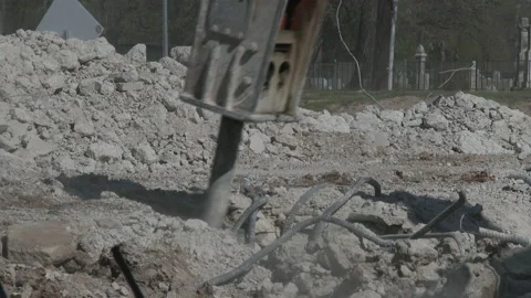 Close of jackhammer breaking up concrete, pulling out rebar, 4K. Stock Footage 151599920