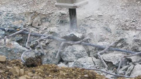 Close-Up of Jackhammer Breaking Reinforced Concrete Stock Footage 344439157