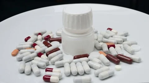 Close up, jar with colored pills rotating Stock Footage 81261485