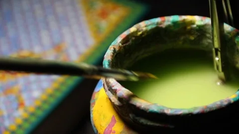 Close Up of the jar with colored water for brush and hand cleaning brush in Stock Footage 86760577