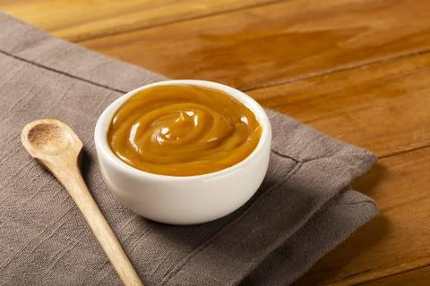 Close-up of jar full of dulce de leche. Dulce de leche, traditional sweet in  Stock Photos