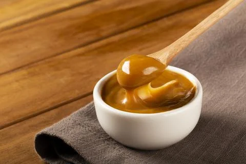 Close-up of jar full of dulce de leche. Dulce de leche, traditional sweet in  Stock Photos