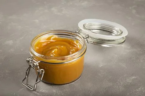 Close-up of jar full of dulce de leche. Dulce de leche, traditional sweet in  Stock Photos