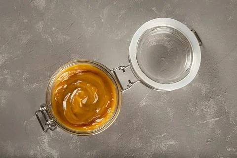 Close-up of jar full of dulce de leche. Dulce de leche, traditional sweet in  Stock Photos