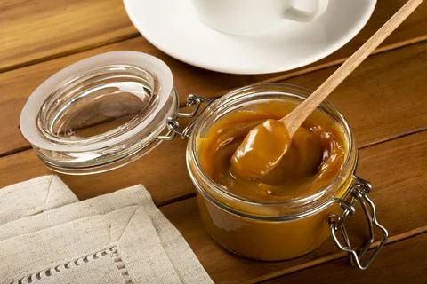 Close-up of jar full of dulce de leche. Dulce de leche, traditional sweet in  Stock Photos