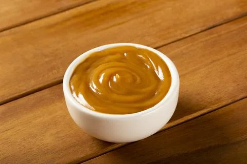 Close-up of jar full of dulce de leche. Dulce de leche, traditional sweet in  Stock Photos