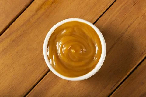 Close-up of jar full of dulce de leche. Dulce de leche, traditional sweet in  Stock Photos