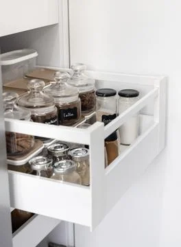 Close-up of jars of spices standing in a kitchen drawer Stock Photos