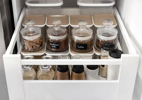 Close-up of jars of spices standing in a kitchen drawer Foto stock