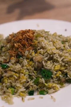 Close up java Indonesian fried rice on white plate with fried onions Stock-Fotos