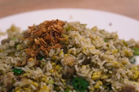 Close up java Indonesian fried rice on white plate with fried onions Stock Photos