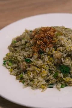 Close up java Indonesian fried rice on white plate with fried onions Stock Photos