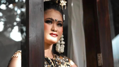 Close-up of Javanese Dancer's Face at Open Window Stock Footage 237481789