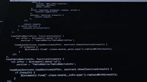 Close-up of JavaScript programming code lines displayed on a dark screen, r.. Stock Footage 311932053