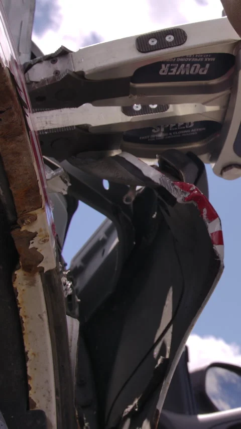 Close up jaws of life being used to open door on car in emergency rescue Stock Footage 331344750