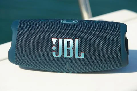 Close up of the JBL Charge 5 column on boat. Portable Bluetooth speaker. Stock Photos