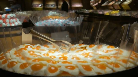 Close-up of jelly sweets in form of scrambled eggs Stock Footage 97405954