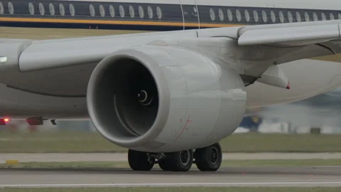Close up of jet engine starting up on modern aircraft before take-off Stock Footage 310908907