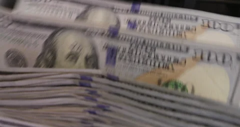 Close up jib shot, electronic money counting machine processing 100 Dollar bills Stock Footage 337086895