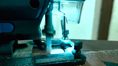 A close-up of a jigsaw with blue backlighting Stock Footage 318075515