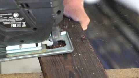 Close-up of a jigsaw cutting a board Stock Footage 139645579