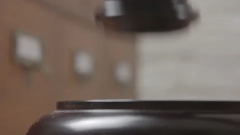 Close-up of a judge hitting a block with a hammer in a courtroom. Stock-Footage 150977483