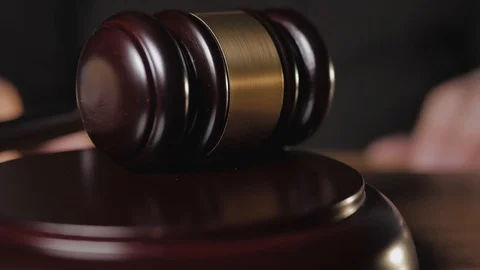 Close - up of the judge knocking three times with a wooden mallet. Stock Footage 121076341