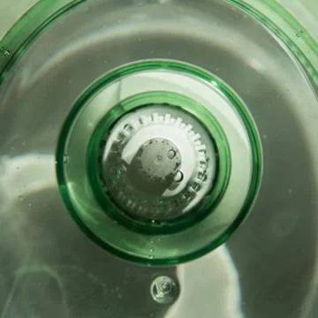 Close-up of a jug with a water purification cartridge. Green. The cartridge s Stock Photos