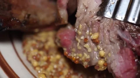 Close-up of Juicy BBQ Beef Steak with Whole Grain Mustard Crust Stock Footage 338212846
