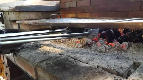 Close-up of Juicy Beef Steaks Grilling on an Open Flame Charcoal BBQ with Tongs Video stock 338213081