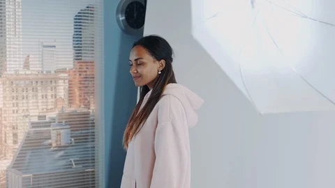 Close-up of jumping black model posing while young professional photographer Stock-Footage 122575620