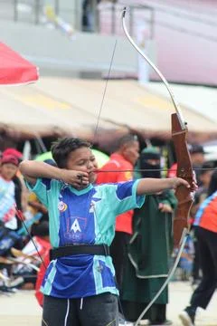 Close Up of Junior Athlete Drawing Bowstring in Archery Stock Photos