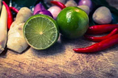 Close up kaffir lime leaf, lemon, lemongrass, galangal, chili, onions and Str Stock Photos